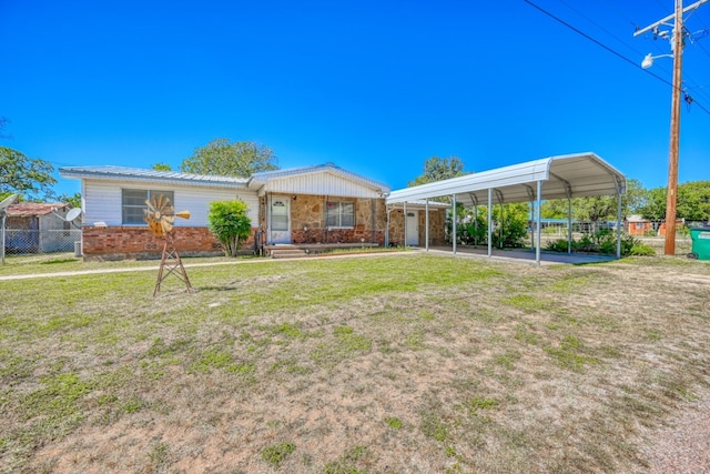 view of yard featuring a porch and a carport