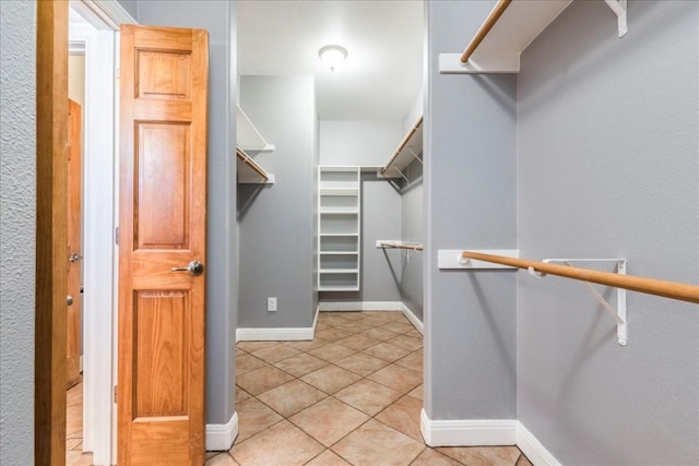 walk in closet featuring light tile patterned floors