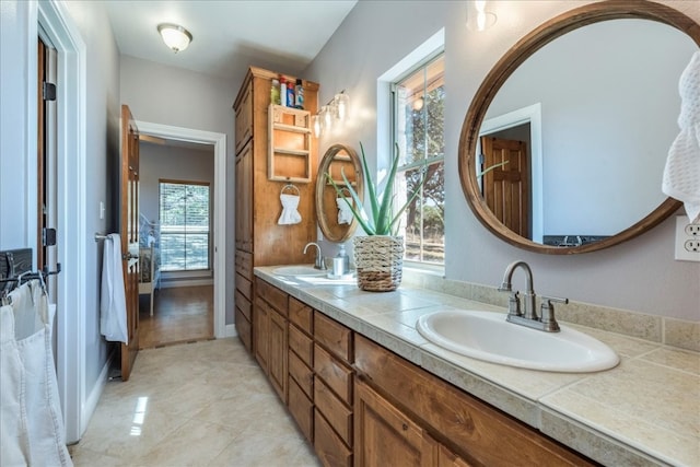 bathroom with vanity, tile patterned floors, and plenty of natural light