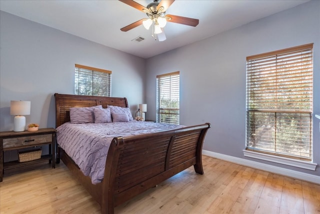 bedroom featuring light hardwood / wood-style flooring and ceiling fan