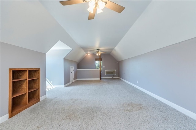 bonus room featuring light carpet, vaulted ceiling, ceiling fan, and a wall mounted air conditioner