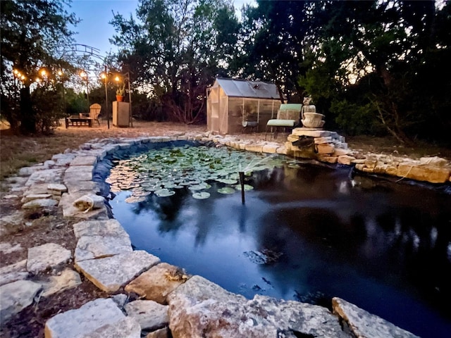 view of pool with a storage unit