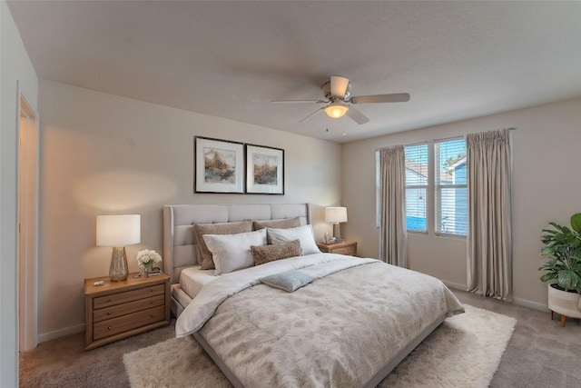 418 Shadow Pt, San Marcos, TX 78666 - bedroom with baseboards, ceiling fan, and light colored carpet
