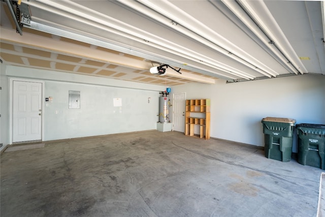 garage featuring water heater, a garage door opener, and electric panel