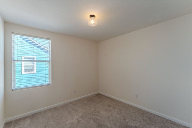 unfurnished room featuring carpet flooring