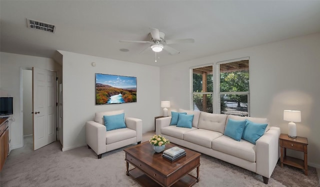 418 Shadow Pt, San Marcos, TX 78666 - living area featuring baseboards, visible vents, light colored carpet, and a ceiling fan