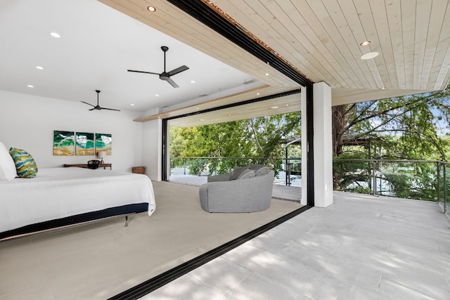 bedroom featuring floor to ceiling windows, ceiling fan, access to exterior, and wooden ceiling