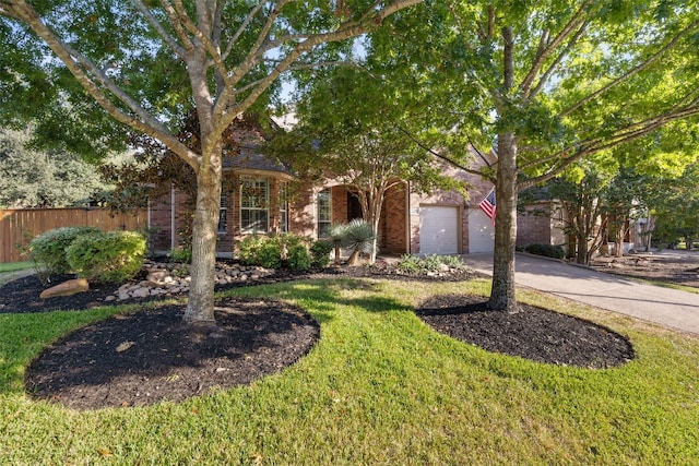 obstructed view of property with a front yard