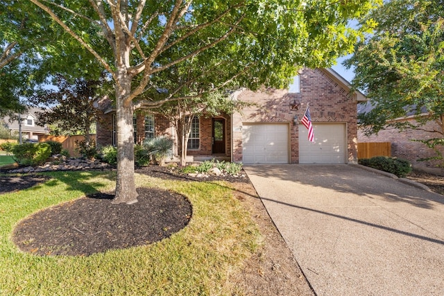 view of front of home with a front yard and a garage