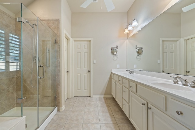 bathroom featuring ceiling fan, vanity, tile patterned flooring, and an enclosed shower