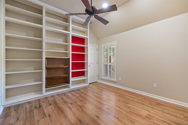 spare room featuring ceiling fan, lofted ceiling, and hardwood / wood-style floors