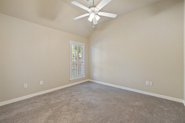 empty room featuring ceiling fan, lofted ceiling, and carpet flooring