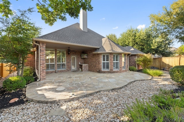 rear view of property with a patio area