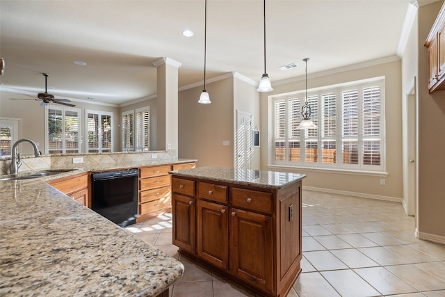 kitchen with pendant lighting, black dishwasher, a center island, sink, and crown molding