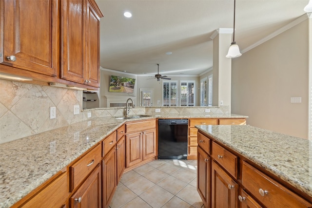 kitchen featuring light stone counters, pendant lighting, sink, dishwasher, and crown molding