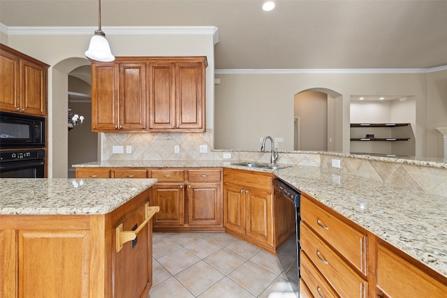 kitchen featuring light stone countertops, crown molding, sink, and black appliances