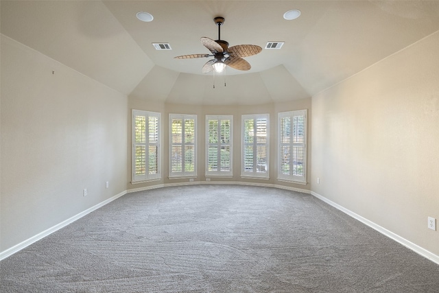 spare room featuring carpet flooring, ceiling fan, and a wealth of natural light