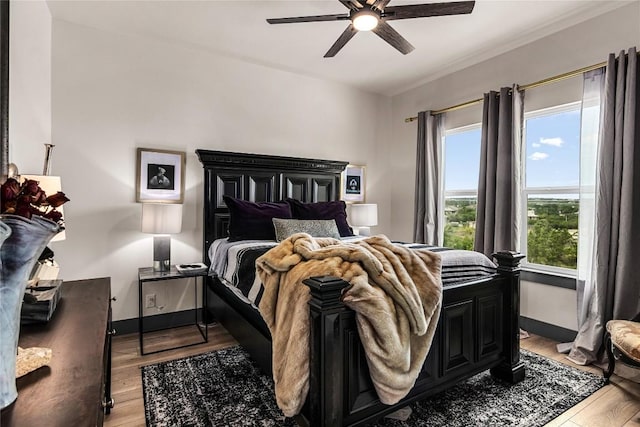 bedroom featuring ceiling fan and light hardwood / wood-style floors