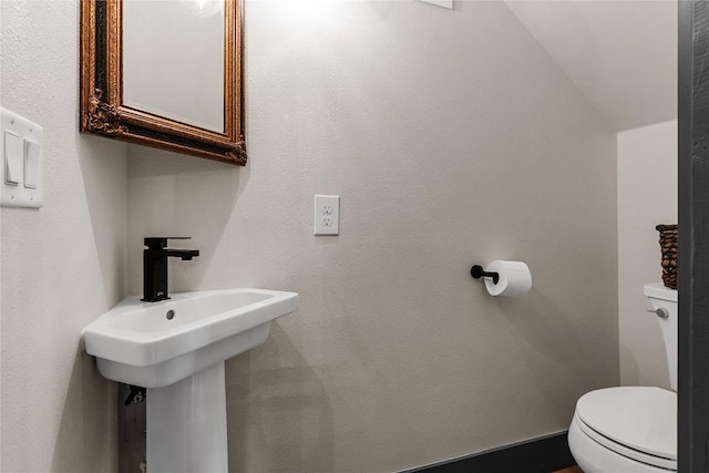 bathroom featuring toilet