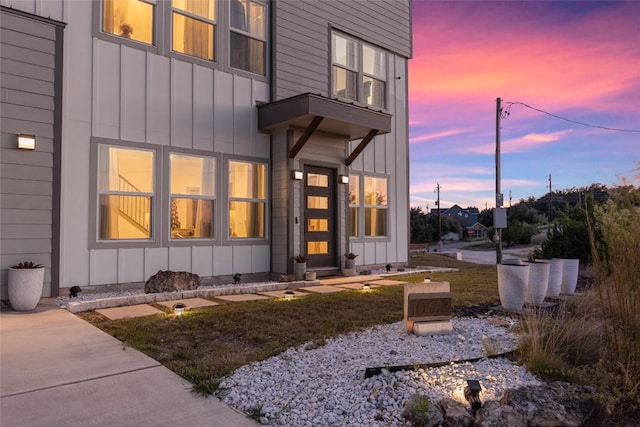 view of exterior entry at dusk