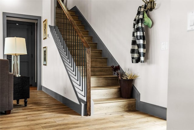 staircase featuring hardwood / wood-style flooring