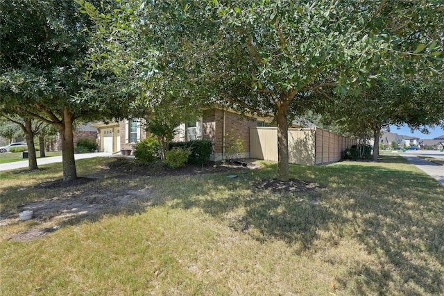 13108 Craven Ln, Manor, TX 78653 - view of property exterior with an attached garage and brick siding