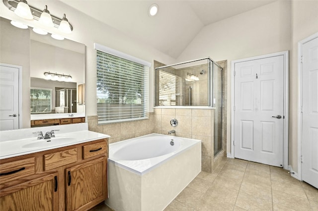13108 Craven Ln, Manor, TX 78653 - full bathroom featuring lofted ceiling, a shower stall, a bath, vanity, and healthy amount of natural light