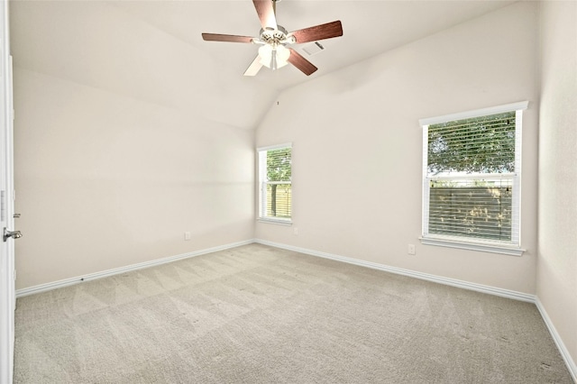 unfurnished room with light carpet, vaulted ceiling, and ceiling fan