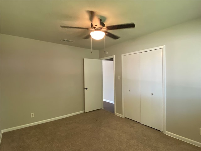 unfurnished bedroom featuring a closet, ceiling fan, and carpet flooring