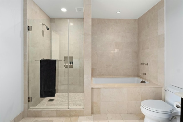 bathroom with shower with separate bathtub, tile patterned flooring, and toilet