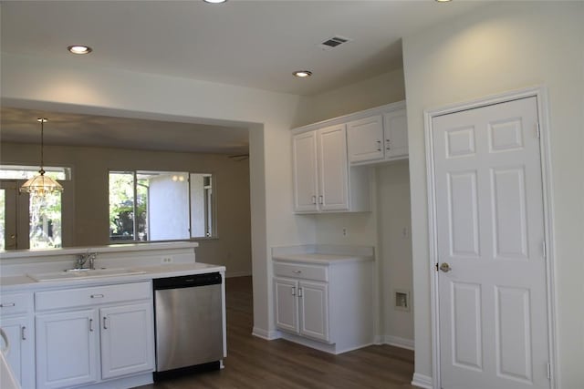 kitchen with dark wood-style floors, visible vents, stainless steel dishwasher, white cabinetry, and a sink