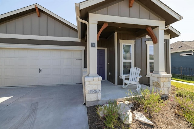 view of front of house featuring a porch and a garage