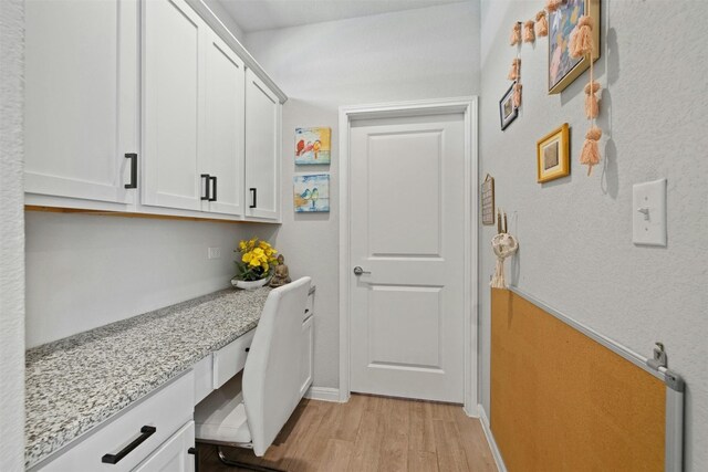 3017 Settlement Dr Unit 30, Round Rock, TX 78665 - laundry room with light wood-type flooring, baseboards, and an office area
