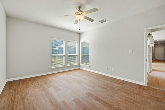 spare room with light hardwood / wood-style floors and ceiling fan