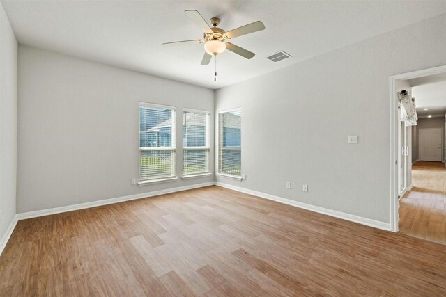 3017 Settlement Dr Unit 30, Round Rock, TX 78665 - spare room with light wood-style floors, ceiling fan, and baseboards
