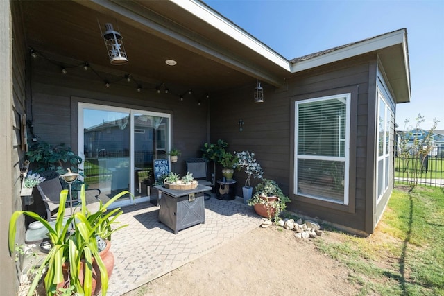 view of patio / terrace featuring an outdoor fire pit