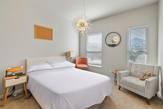 3017 Settlement Dr Unit 30, Round Rock, TX 78665 - carpeted bedroom featuring a chandelier and baseboards