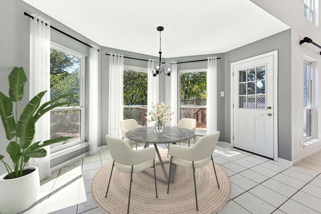 dining room featuring light tile patterned floors and a chandelier