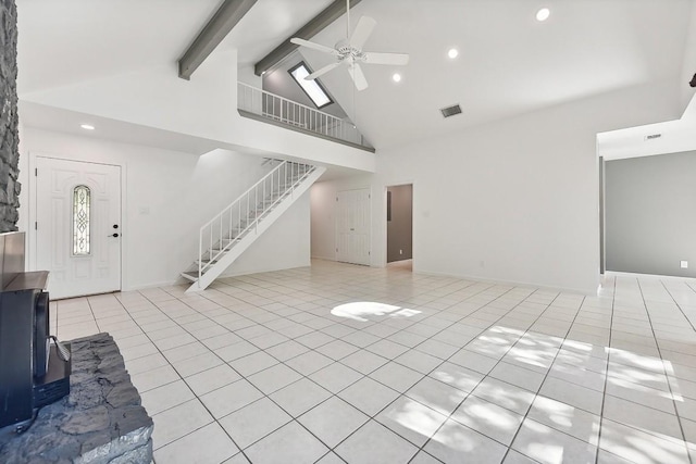 unfurnished living room with stairs, high vaulted ceiling, beam ceiling, and light tile patterned flooring