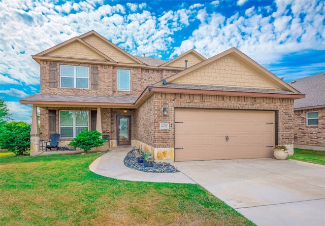 craftsman house featuring a front yard and a garage