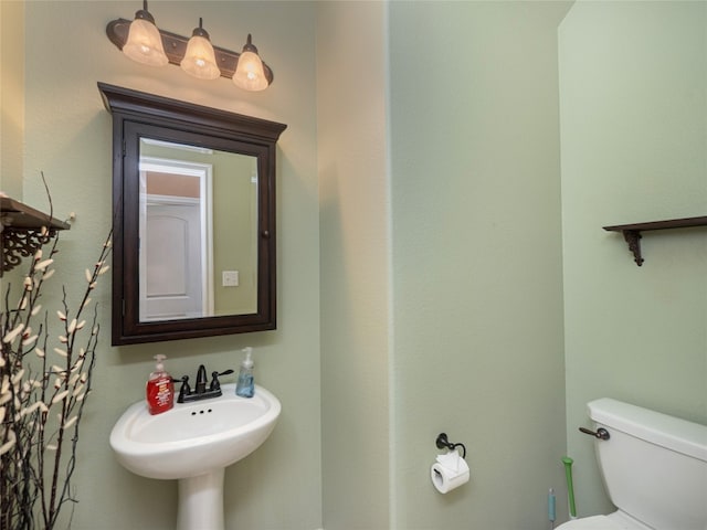 bathroom with toilet and sink