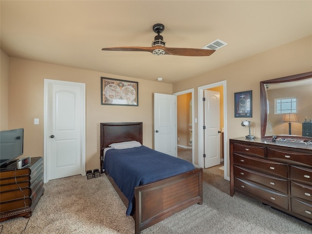 bedroom featuring light carpet and ceiling fan