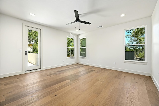 unfurnished room with light wood-type flooring and ceiling fan