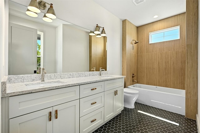 full bathroom with bathing tub / shower combination, toilet, and vanity