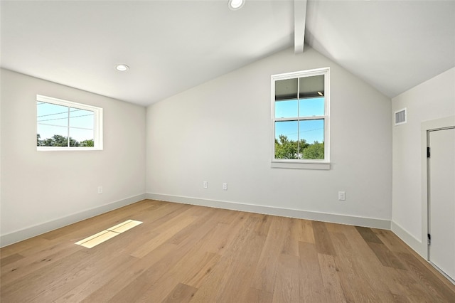 bonus room with light hardwood / wood-style flooring and lofted ceiling with beams