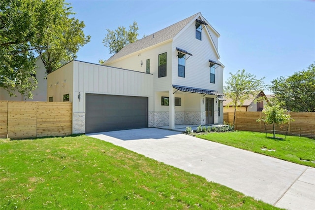 view of front facade with a garage and a front lawn