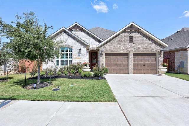 view of front of property with a garage and a front yard