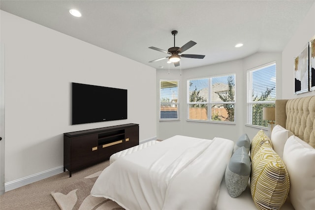 bedroom featuring light carpet and ceiling fan