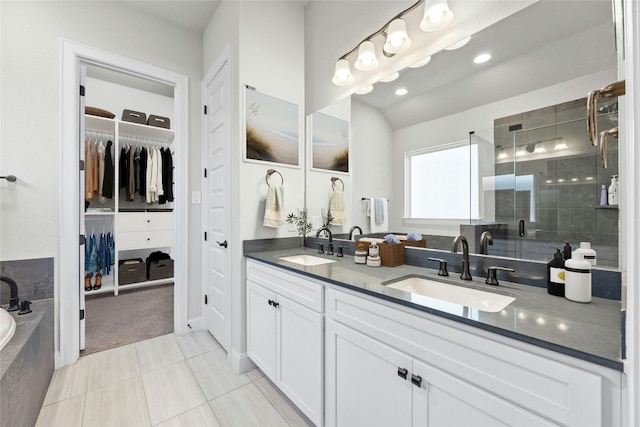 bathroom featuring tile patterned flooring, vanity, and independent shower and bath