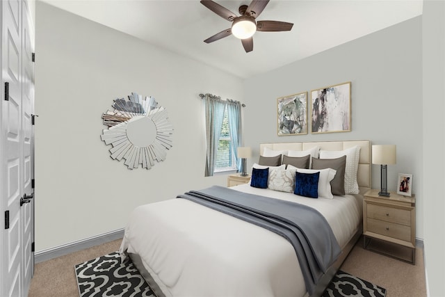 bedroom with ceiling fan and light colored carpet